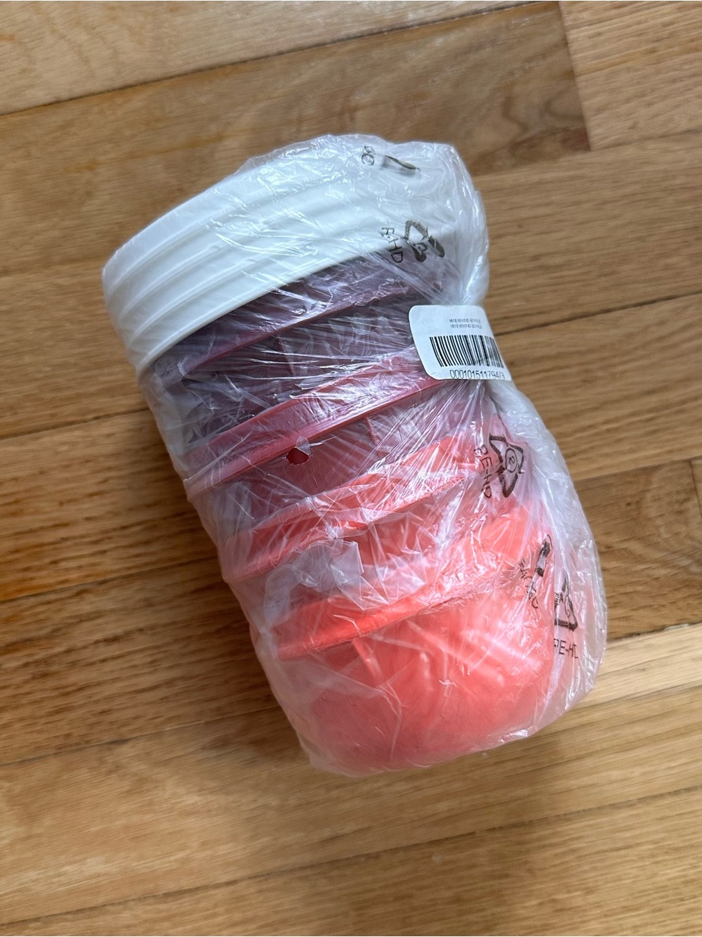 Stack of Plastic Cups in Coral and White